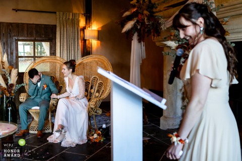 Laughter fills the room at Domaine des Saints Pères, Montagnole, as the newlyweds respond with joy to the bridesmaid’s heartfelt and humorous speech.