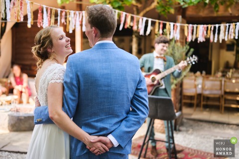 The bride and groom share genuine enjoyment at the Noord Holland reception venue as the best man delivers a memorable performance, creating cherished moments at the venue.