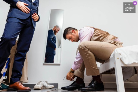 The Scene Is Set In Dordogne, France, As A Wedding Witness Observes Best Friend’s Last-Minute Pre-Ceremony Preparations. Château de Beauséjour in Dordogne, France sets the scene as a wedding witness quietly observes his best friend’s final she tying moments of preparation before the ceremony.