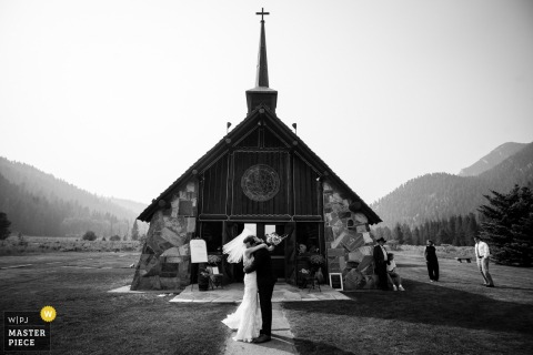 At Big Sky, Montana, the newlyweds make their way out of the chapel, soaking in mountain views and hugs.
