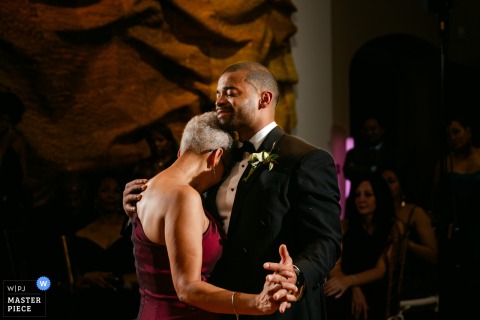  At The Branch Museum in Richmond, VA, a mother and son take to the dance floor, sharing an emotional dance in front of friends and family during the wedding reception.