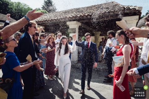 Newlyweds Exit Jubilantly Beneath Lavender Cascade After Civil Ceremony At Medieval Hall In Saint-Georges De Montclard, Dordogne The newlyweds enjoy a jubilant exit beneath a cascade of tossed lavender after their civil ceremony at the medieval hall in Saint-Georges de Montclard, Dordogne.