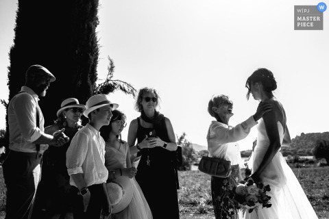 Congratulations Pour In For The Newlyweds Surrounded By Loving Guests At Domaine Des Patras In France. Congratulations are in order at Domaine des Patras in France, where newlyweds are surrounded by guests eager to embrace them and offer heartfelt wishes for their future together.