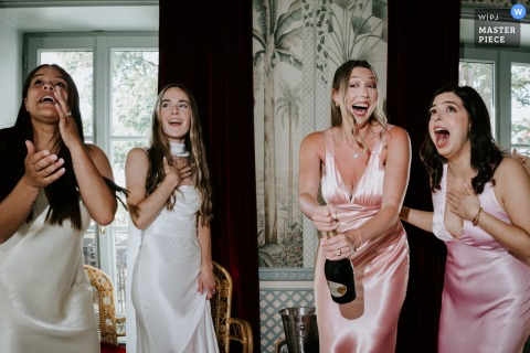 Guests Celebrate With Cheerful Laughter As Champagne Corks Soar At Hotel Particulier Montmartre In Paris, France. Champagne corks fly at Hotel Particulier Montmartre in Paris, sparking amusing and surprised reactions from guests as they celebrate in this French venue.