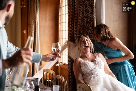 Dinner Turns Lighthearted At Château De Ripaille In Thonon-les-Bains, Haute-Savoie When Bride’s Veil Is Stepped On. Laughter erupts during dinner at Château de Ripaille in Thonon-les-Bains when someone accidentally steps on the bride's veil, making for a lighthearted and memorable mishap.