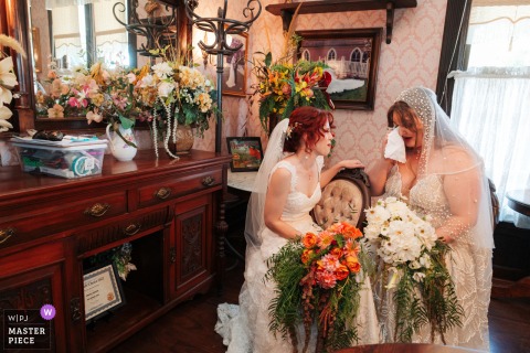   At Edwards Mansion in Redlands, California, the couple shares an emotional, private moment together immediately after their ceremony, cherishing their first quiet time as newlyweds.