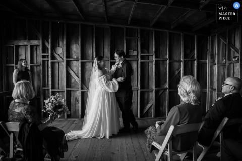 Mendocino Coast Botanical Gardens, CA, Hosts A Couple’s Tender, Anticipatory Moment Before Their First Kiss Amidst Nature’s Beauty. During the ceremony at Mendocino Coast Botanical Gardens in Mendocino, CA, the couple shares a tender, anticipatory moment just before their first kiss, surrounded by nature’s beauty.
