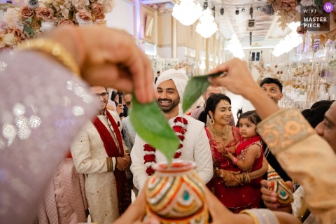At The Event Hall In Telford, UK, A Vibrant Hindu Wedding Welcome Ceremony Begins With Family And Colorful Attire. At the Event Hall in Telford, UK, the Hindu wedding’s welcome ceremony begins, featuring vibrant traditions and colorful attire as family and guests gather for this important occasion.