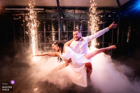 At The Reception Venue, The First Dance With Fire Burns Bright With Theatrical Heat The first dance with fire at the reception venue burns bright with theatrical heat, where flame, music, and embrace combine into a dramatic little republic of wedding-night spectacle.