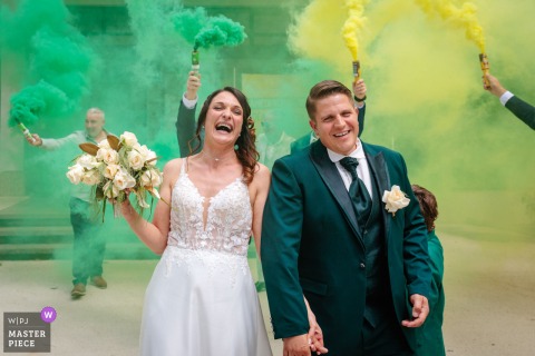 At Vizille Town Hall In Vizille, France, Green And Yellow Smoke Mark The Exit At Vizille town hall in Vizille, France, the civil ceremony ends with a quiet release of greeen and yellow smoke grenades, as the formality gives way to the softer life ahead.
