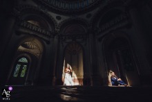 A couple poses in separate patches of light, sharing a portrait session at Schloss Schwetzingen on their wedding day