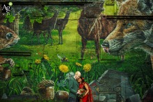 Wedding photo at Arta Glasgow.  Bride and groom illuminated by flash, standing in front of a textured, painted wall.