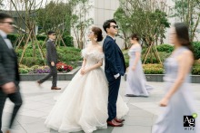 At Hanlai Hotel in Taipei, Taiwan, the couple shares lively, playful scenes with their siblings as laughter and movement fill the area during their wedding photo session.