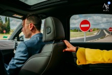 In the groom's parents' car en route to the church, a poignant detail captures the mother's hand alongside "no entry" signs, adding an emotional layer to the journey.