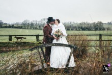 At L'étoile de Forges, the bride and groom share a kiss amid the snow, creating a romantic and serene winter scene.