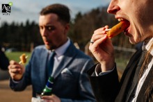 Wedding guests savor canapés outdoors during the drinks reception at Hobbit Hill in Lancashire, England, the scenic surroundings adding to the convivial spirit of the gathering.