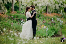 Couple shares a quiet, intimate session together in the vibrant floral gardens at Gravetye Manor.