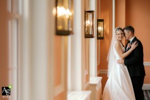 A Quiet Portrait Session Features The Couple Inside The Historic Madison Club Interior In Madison Wisconsin The bride and groom enjoy a quiet portrait session away from the crowd for cozy portraits inside the elegant and historic Madison Club in Madison, Wisconsin.