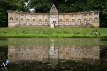 A distant reflection shot of B and G at the Stowe House, capturing the full view of the structure.