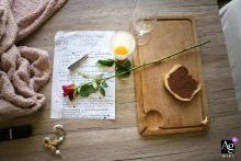 An elegant Dordogne, France photograph of a wedding day to do list displayed neatly on a saloon table creates a thoughtful, stylized artistic detail portrait of the couple's preparations.