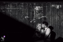 Sunset Wedding Portrait With Dramatic Shadows In Strijen The Netherlands Photoshoot A couple smiles broadly during their sunset wedding day photoshoot in Strijen, the Netherlands, as dramatic, elongated shadows and sunlight cut diagonally across the frame.