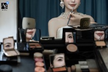 Fujian, China is the setting for this artistic wedding day detail, a close-up photograph capturing the beautiful reflections in the makeup mirrors used by the bride.