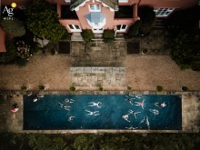 The Moult, Salcombe, serves as the picturesque setting for an artistic aerial view capturing the calm turquoise water of a morning swim on the wedding day.