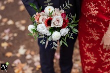 Parc Molson in Montreal, Quebec, serves as the setting where a Chinese bride and groom center their portrait session around the bouquet details, highlighting its significance in their wedding photographs.