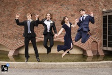   Outside MIT Chapel in Cambridge, Massachusetts, the groom and his friends leap into the air for a fun and energetic group portrait, capturing the joy of the day.