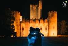 In front of the castle known as Château de Roquetaillade in Mazères, the newlyweds pose together, the historic site providing a formal architectural background for their wedding portrait.