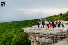   In New Paltz, New York, a mountain wedding offers panoramic views that stretch for miles, the couple celebrating their day with breathtaking scenery all around.