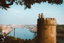   Amid the lush Palacio de Cristal gardens in Porto, Portugal, an elopement couple enjoys time alone, surrounded by greenery and the peaceful atmosphere of the park.
