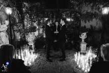   A winter evening ceremony in Montmartre, Paris is set aglow with candlelight, the nighttime atmosphere creating a romantic and magical ambiance for the celebration.