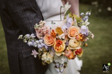 A vibrant and colorful bouquet stands out at Horton Grange Country House in West Yorkshire, its fresh blooms adding joyful elegance to the wedding setting.