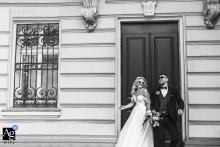 Near the gardens of the National Art Gallery in Sofia, the couple stands back to back, laughing and playfully glancing over their shoulders, their joyful energy mirrored by the outdoor setting.