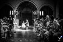 During the ceremony at Bovendonk in Hoeven, Netherlands, the couple's children walk down the chapel aisle carrying the wedding rings, creating a heartfelt moment that brings the family together.