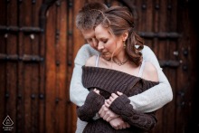 Oxford, United Kingdom couple embracing in archway during a lifestyle portrait session