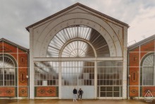 A unique building in Vierzon showcases eclectic, whimsical architecture with colorful designs, capturing attention and provoking curiosity.