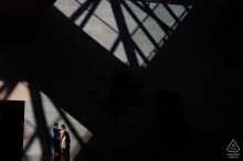 At the National Gallery of Art, DC, a couple enjoys an engagement session bathed in fascinating light and shadow patterns.