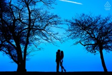 Silhouetted couple stands together at Fullerton Beach, Chicago.