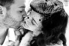 Romantic black and white close-up of couple kissing in Ravenna city centre, Italy.