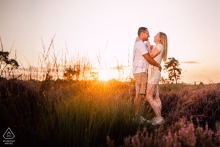 Loonse en Drunense Duinen Sunrise Embraces Engaged Couple for Pre-Wedding Shoot Engaged couple at Loonse en Drunense Duinen, embracing during an amazing sunrise pre wedding shoot.