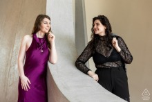 TWA Hotel's Iconic Divide: A Couple's Gaze Across Architectural History Couple stands on opposite sides of dividing wall, gazing at each other, inside TWA Hotel.