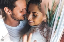 Praia do Francês, AL - Couple shares tender closeness in engagement portrait.