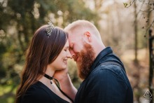 Engaged couple romantically pose in Münsterland, Germany, for an engagement portrait.