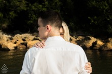 An intriguing and intimate portrait captured in São Paulo, showing a couple whose physical closeness contrasts with the man's averted gaze and the woman's singular, direct eye contact with the viewer.