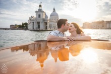 Venetian Canal Romance: Newly Engaged Couple's Private Water Taxi Excitement A newly engaged couple rides a private water taxi through the legendary canals of Venice, Italy. This portrait captures the excitement of their status on the city's unique transport.