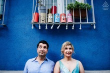 A Colorful Engagement Portrait Shows The Pre-Wedding Couple Exploring The Joyful Streets Of Balat, Istanbul, Türkiye This colorful engagement portrait features a couple exploring the historic and vibrant streets of Balat, Istanbul, Türkiye, during a joyful pre-wedding session filled with authentic local charm.