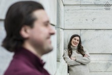 Inside the marble atrium of the Cleveland Museum of Art, the engaged couple poses with elegance, their loving expressions and stylish attire complemented by the light-filled sophistication of the museum’s impressive interior.