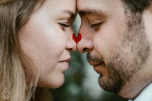 At The Matthews House in Cary, North Carolina, the couple stands together, each smiling as their red dotted noses form a full heart, their warmth and unity reflected in the historic Southern setting.